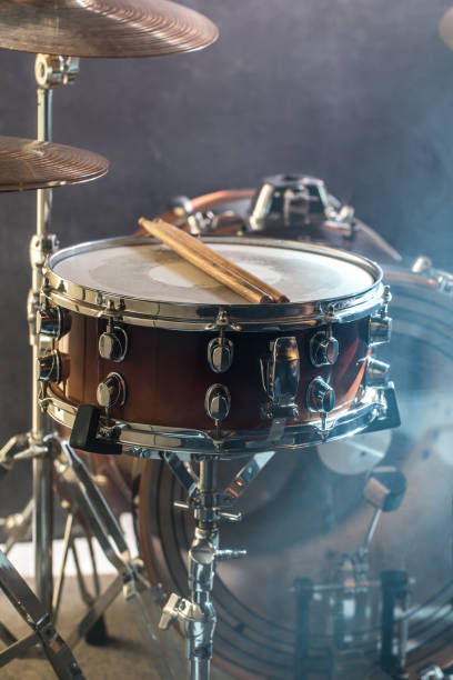 istock musical instruments drum kit, flash of light, a beautiful light in the background with copy space 890305796