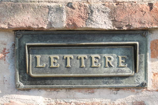istock Old letterbox at a historic facade 890312296