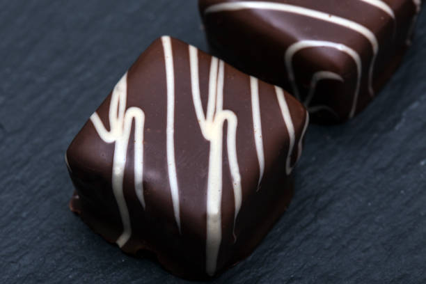 istock Chocolate candies on dark slate plate 890320132