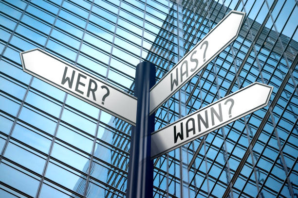 istock Wer?, was? wann? (German)/ who?, what? when? (English) - crossroads sign 890332002