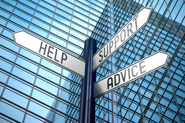 istock Help, support, advice - crossroads sign, office building 890334664
