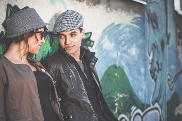 istock Couple flirting outdoors in the city 890349056
