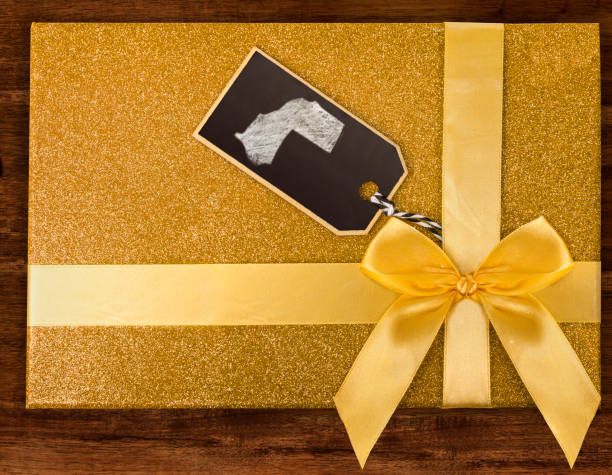 istock A gift box with Western Sahara drawn on a label with chalk.(series) 890349204