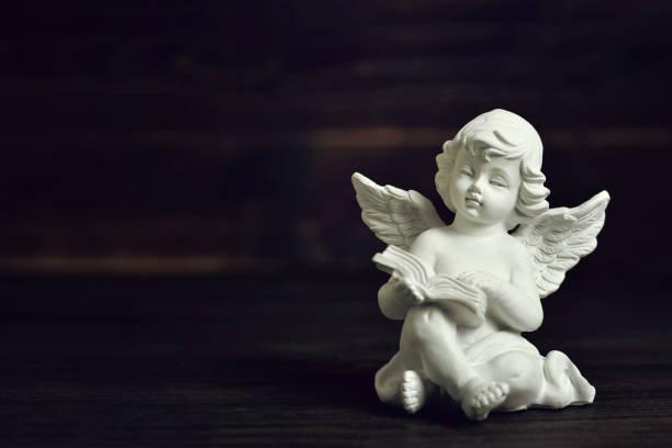 istock Angel guardian on dark background 890349430
