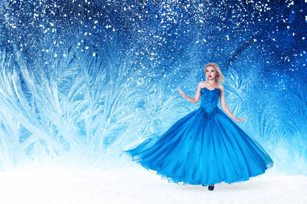 Beautiful young woman in fairy tale forest with long luxurious dress