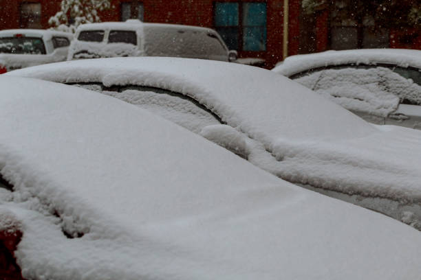 istock Windshield wipers of an snow covered car after heavy snowfall 890366348
