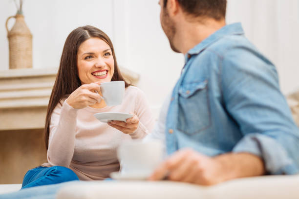 istock Happy enthusiastic woman listening attentively 890366424