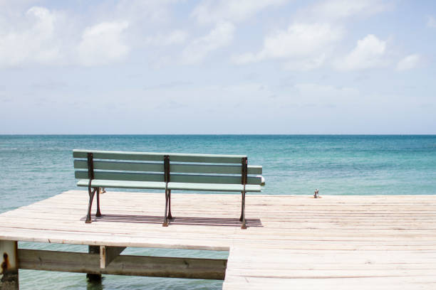 Bench overlooking ocean in Grenada stock photo