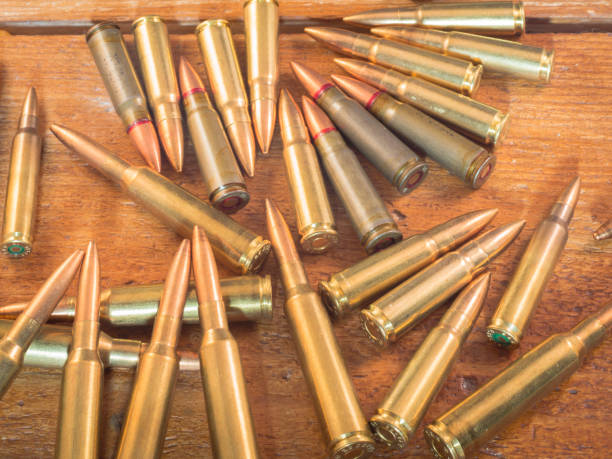 istock Many bullet on the wood 890375112