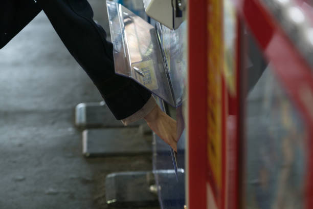 Woman buying with a vending machine.