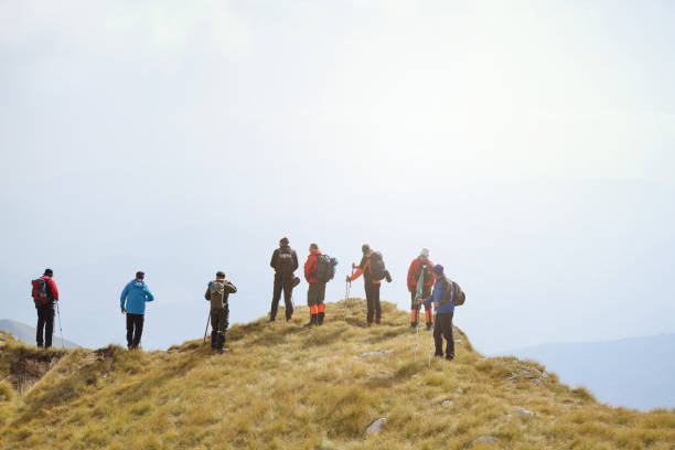 istock Group of tourists with backpacks on a mountain trail 890380492
