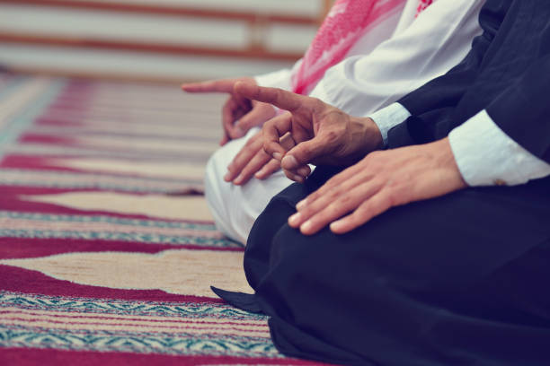 istock Two religious muslim man praying together inside the mosque 890383438