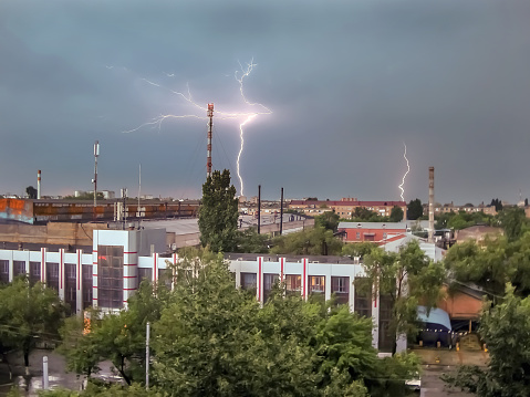 lightning and thunderstorm over the evening summer city