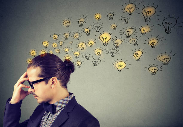 istock Man wearing nerdy glasses having many ideas thinking organizing thoughts 890386354