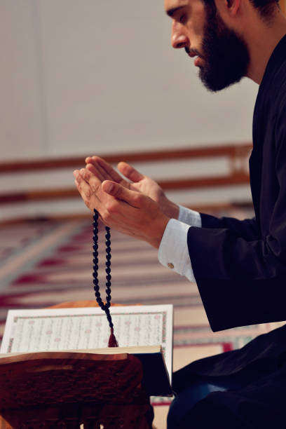 istock Religious muslim man praying inside the mosque 890386396