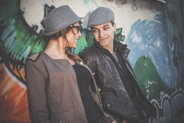 istock Couple flirting outdoors in the city 890393168