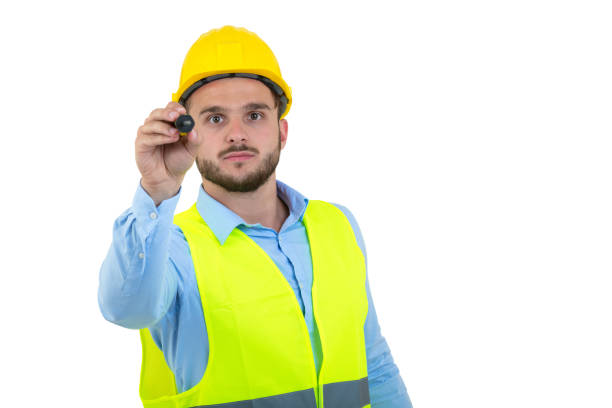 istock Happy professional engineer pointing to something isolated on white background. 890402216