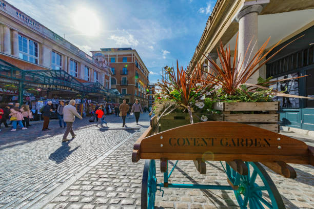 Covent Garden London London: This is Covent Garden piazza, a popular tourist area for shopping in central London on October 06, 2017 in London covent garden photos stock pictures, royalty-free photos & images