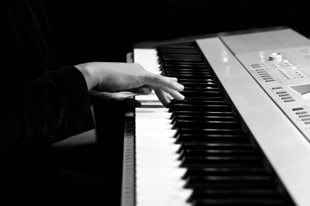 istock The hands of a musician playing on a synthesizer 890421082