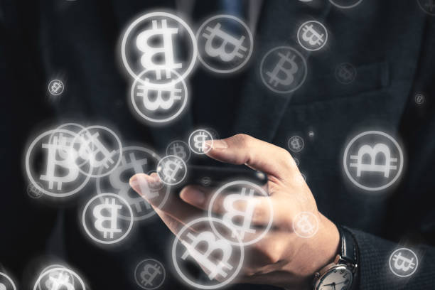 istock businessman operating a bit coin with a smartphone 890426256