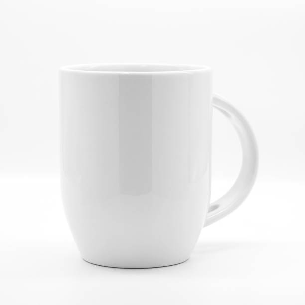 istock Blank coffee mug and spoon on modern white backdrops. Empty tea cup for your design. 890453616