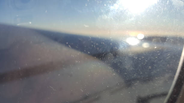 istock see sky through the airplane window 890492060