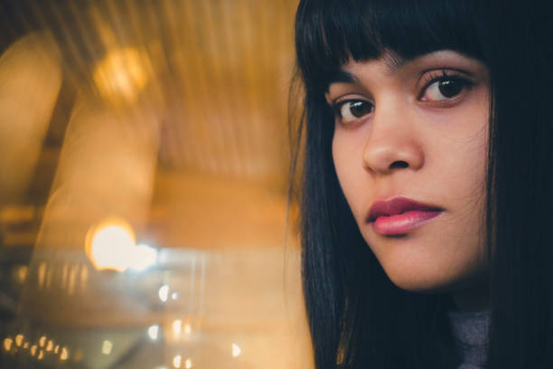 istock Young woman looking at camera. 890504742