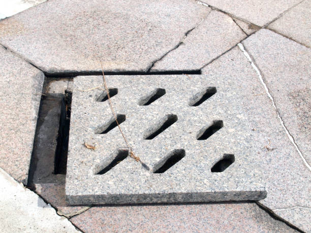istock Sewer manhole on the urban asphalt road 890515950