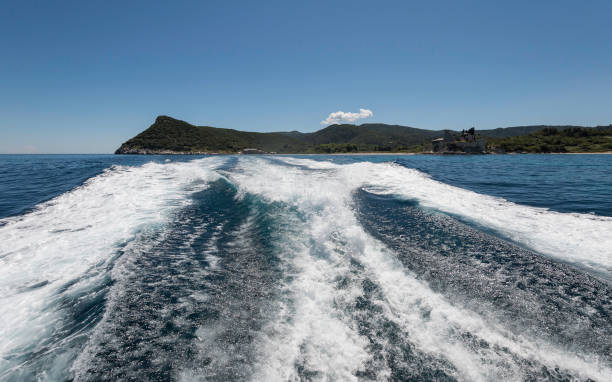 istock Water trail foaming behind a ferry boat 890518962
