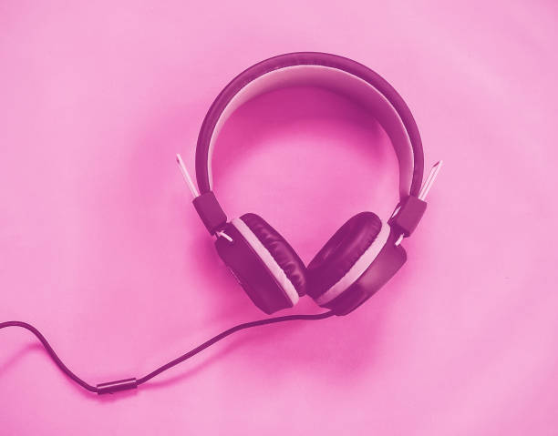 istock black headphones isolated pink vintage tone. 890531468