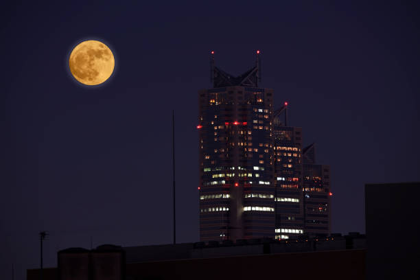 istock Full moon with high-rise buildings 890531738
