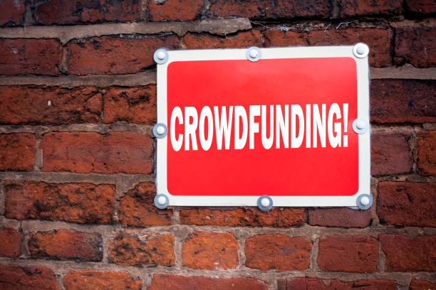 istock Hand writing text caption inspiration showing Crowdfunding concept meaning Business Fundraising Project Funding written on old announcement road sign with background and copy space 890542726