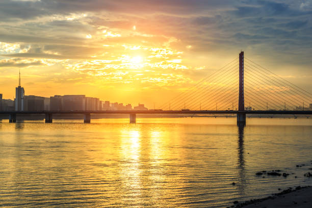 istock River and city skyline scenery at sunset 890542756