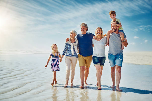 istock Family walks on the beach make a weekend complete 890554466