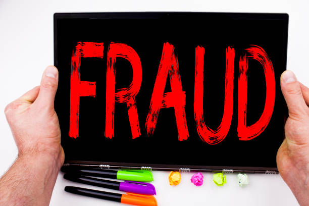 istock Fraud text written on tablet, computer in the office with marker, pen, stationery. Business concept for Fraud Crime Business Scam white background with copy space 890568656