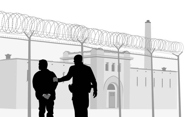 Prison Security Personnel Old prison with a guard escorting a handcuffed prisoner to the entrance prison illustrations stock illustrations