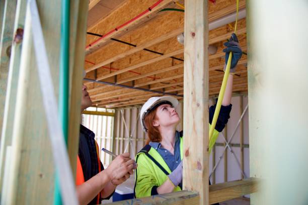 istock SYD112017 Female construction worker working doing measurement 890578152