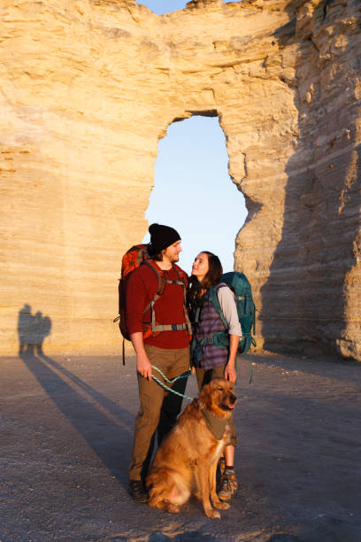 istock Couple hiking together in the wilderness 890578460