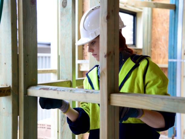istock SYD112017 Female construction worker working doing measurement 890578648