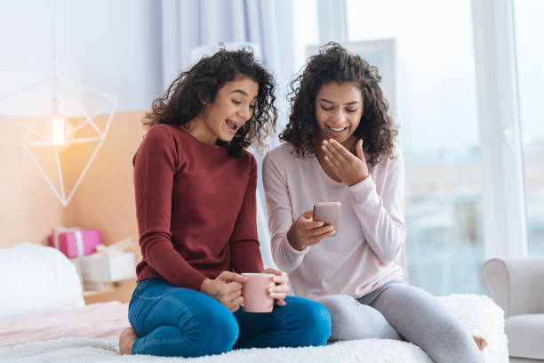 istock Emotional girl getting excited over boy message 890589130