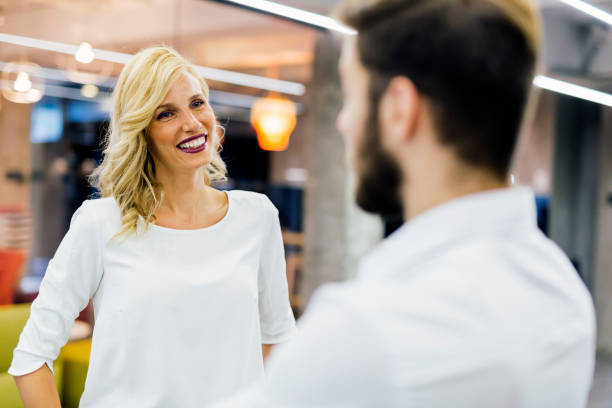 istock Beautiful saleswoman talking to customer 890589808