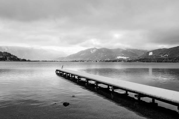 Lake Tegernsee in winter in black and white. Photograph taken in December near Gmund, Bavaria, Germany.