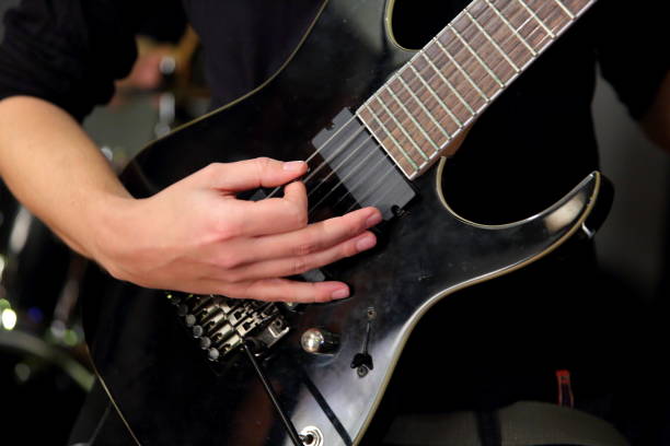 istock In rock bands, the main and necessary string instrument is usually an electric guitar. 890612572