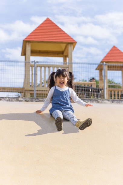istock Father and girl playing in the park 890622192