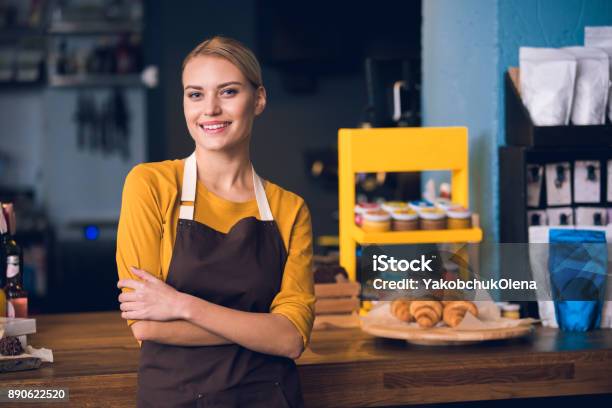 Smiling Female Worker Situating In Cafe Stock Photo - Download Image Now - Retail Occupation, Owner, Small Business