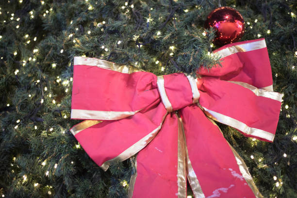 istock Beautiful red big bow on a Christmas tree 890629644