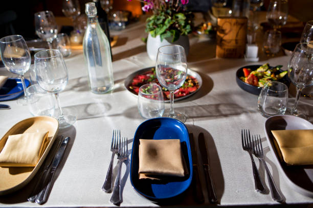 istock service with silverware and glass stemware for an event party 890646800