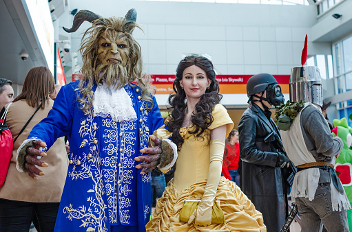 Cosplayers dressed as The Beast and Belle from the Disney film 'Beauty and the Beast'  at Birmingham MCM Comic Con.