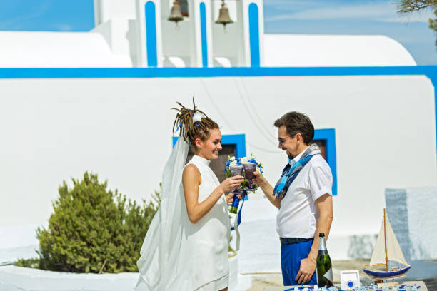 istock Young wedding couple drinking champagne 890649852