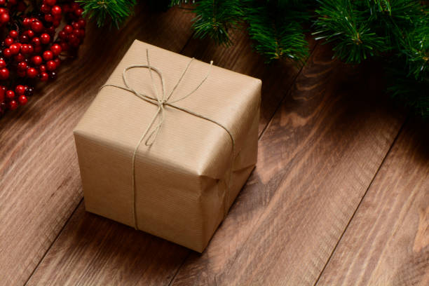 istock Gifts box on wooden background 890656506